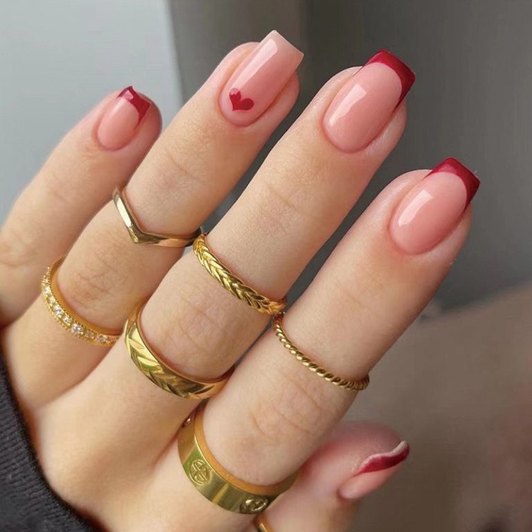 red-tipped-nails-with-single-heart-accent-1